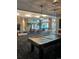 Community room with pool table, comfortable seating and large windows at 1150 Inca St # 59, Denver, CO 80204