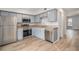 Modern kitchen with stainless steel appliances and light gray cabinets at 1150 Inca St # 59, Denver, CO 80204