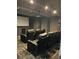Community theater room with comfortable reclining chairs and large screen at 1150 Inca St # 59, Denver, CO 80204