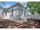 Backyard with a patio and green space, partially shaded by mature trees at 1076 Mariposa St, Denver, CO 80204