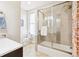 Updated bathroom featuring a glass-enclosed shower and modern fixtures at 1076 Mariposa St, Denver, CO 80204