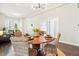 Bright dining room boasts a round table with seating for four and modern light fixture at 1076 Mariposa St, Denver, CO 80204