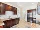 Kitchen features dark wood cabinets, modern appliances and ample counter space at 1076 Mariposa St, Denver, CO 80204