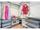 Organized walk-in closet featuring metal shelving, hanging rods, and space for accessories at 1076 Mariposa St, Denver, CO 80204