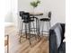 Dining area showcasing a round table with barstools at 1206 S Reed St, Lakewood, CO 80232