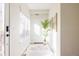 Bright entryway features modern decor, a stylish rug, and ample natural light at 1206 S Reed St, Lakewood, CO 80232