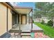Backyard patio with wooden deck, covered awning, and access to lush greenery at 18538 E Whitaker Cir # A, Aurora, CO 80015