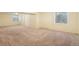 Unfinished basement featuring carpeted floors and a window at 18538 E Whitaker Cir # A, Aurora, CO 80015