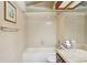 Standard bathroom with a shower-tub, framed picture, towel rack and a basket of toilet paper at 18538 E Whitaker Cir # A, Aurora, CO 80015