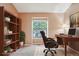Bedroom featuring a brown chair, a desk with a computer, and a bookshelf at 18538 E Whitaker Cir # A, Aurora, CO 80015