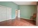Large bedroom with hardwood floors, ensuite bathroom, and lots of closet space at 18538 E Whitaker Cir # A, Aurora, CO 80015