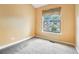 Bedroom featuring carpeted floors and a window at 18538 E Whitaker Cir # A, Aurora, CO 80015