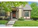 Charming home with a well-manicured lawn and neutral-colored facade with stone and brown accents at 18538 E Whitaker Cir # A, Aurora, CO 80015