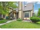 Charming home with a well-manicured lawn and neutral-colored facade with stone and brown accents at 18538 E Whitaker Cir # A, Aurora, CO 80015