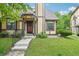 Charming home with a well-manicured lawn and neutral-colored facade with stone and brown accents at 18538 E Whitaker Cir # A, Aurora, CO 80015