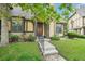 Charming home with a well-manicured lawn and neutral-colored facade with stone and brown accents at 18538 E Whitaker Cir # A, Aurora, CO 80015