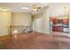 Open-concept living space with hardwood floors adjacent to the kitchen at 18538 E Whitaker Cir # A, Aurora, CO 80015