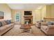 Comfortable living room featuring a stone fireplace, ample seating, and a cozy, inviting atmosphere at 18538 E Whitaker Cir # A, Aurora, CO 80015
