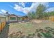 Expansive backyard featuring a well-manicured lawn, rock landscaping, and scenic views at 24701 Us Hwy 40, Golden, CO 80401
