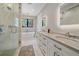 Bright primary bathroom featuring double vanity with marble countertops, and soaking tub at 24701 Us Hwy 40, Golden, CO 80401
