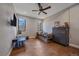 ' bedroom with hardwood floors, multiple windows for natural light, and a large dresser at 24701 Us Hwy 40, Golden, CO 80401