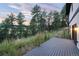 Inviting deck overlooking a lush green landscape and mature trees at 24701 Us Hwy 40, Golden, CO 80401