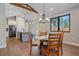 Cozy dining room featuring hardwood floors, a modern chandelier and natural light at 24701 Us Hwy 40, Golden, CO 80401