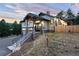 Gorgeous home exterior with stone accents and meticulous landscaping and a long stairway at 24701 Us Hwy 40, Golden, CO 80401