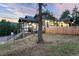 Charming home featuring a stone staircase, covered porch, and a newly installed wooden fence at 24701 Us Hwy 40, Golden, CO 80401