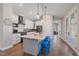 Spacious kitchen with modern white cabinets, marble countertops, and stainless steel appliances at 24701 Us Hwy 40, Golden, CO 80401