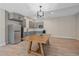Kitchen/Dining space features stainless steel refrigerator and gray kitchen cabinets at 24701 Us Hwy 40, Golden, CO 80401