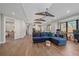 Open-concept living room boasting hardwood floors, a large window and a comfortable sofa at 24701 Us Hwy 40, Golden, CO 80401