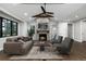 Cozy living room with a stone fireplace and stylish furniture at 24701 Us Hwy 40, Golden, CO 80401