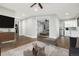 Bright living room with an open floor plan, kitchen and bedroom in background at 24701 Us Hwy 40, Golden, CO 80401