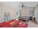 Vaulted ceiling main bedroom with wood floors, ceiling fan, large windows, and a modern stylish area rug at 24701 Us Hwy 40, Golden, CO 80401