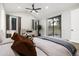 Bright main bedroom featuring vaulted ceiling, view to outside and hardwood flooring at 24701 Us Hwy 40, Golden, CO 80401