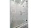 Modern marble shower with glass door, bench, and niche provides a luxurious bathing experience at 24701 Us Hwy 40, Golden, CO 80401