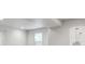 Bright and unfinished basement space with white walls and a small window at 6315 N Emporia St, Denver, CO 80238