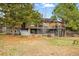 Spacious backyard with a multi-level deck, featuring a patio area and lush greenery at 6755 Garrison St, Arvada, CO 80004