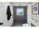 Modern bathroom featuring walk-in shower with black hexagon tile and dual shower heads at 6755 Garrison St, Arvada, CO 80004