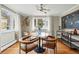 Cozy dining area featuring hardwood floors, stylish light fixture, and chalkboard wall art at 6755 Garrison St, Arvada, CO 80004