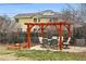 Charming patio with pergola, dining set, and landscaping, ideal for outdoor entertaining and relaxation at 6755 Garrison St, Arvada, CO 80004