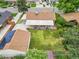 Aerial view of the home showing the roof, backyard, patio, and surrounding neighborhood at 2121 W 73Rd Pl, Denver, CO 80221