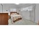 Cozy bedroom with wooden furniture and a decorative bedspread at 2121 W 73Rd Pl, Denver, CO 80221