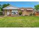 Well-maintained single-Gathering home boasts a lovely lawn and inviting front porch at 2121 W 73Rd Pl, Denver, CO 80221