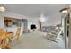 Spacious living room featuring ample seating and a convenient pass-through to the kitchen at 2121 W 73Rd Pl, Denver, CO 80221