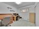 Office with vintage desk, rolling chair, and shelving at 2121 W 73Rd Pl, Denver, CO 80221
