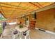Outdoor patio with a covered awning, brick walls, and seating area ideal for relaxing and entertaining guests at 2121 W 73Rd Pl, Denver, CO 80221