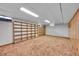 The room includes wall-to-wall bookshelves, a drop ceiling with lights, and carpeted floors, ready for customization at 2121 W 73Rd Pl, Denver, CO 80221