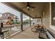 Covered back porch offers seating, ceiling fans, and playground views at 22662 E Narrowleaf Cir, Aurora, CO 80016
